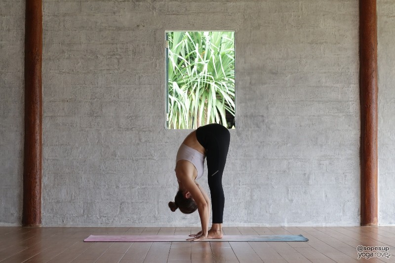 standing forward fold- yoga pose for back flexibility