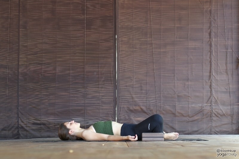 yogi practicing reclined bound angle restorative