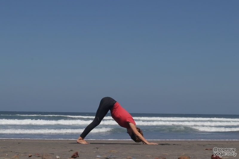 yogi practicing downward dog for weight loss