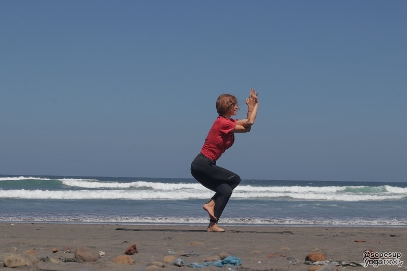 yogi practicing eagle pose for weight loss