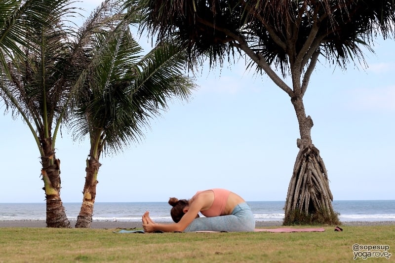 yogi practicing seated fold post run.