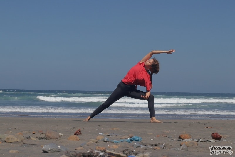 yogi practicing extended side angle for weight loss