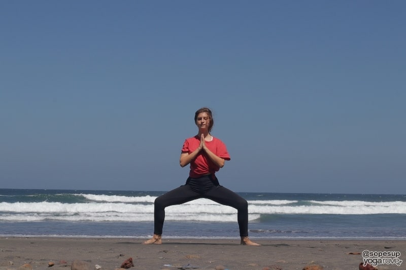 yogi practicing goddess pose for weight loss