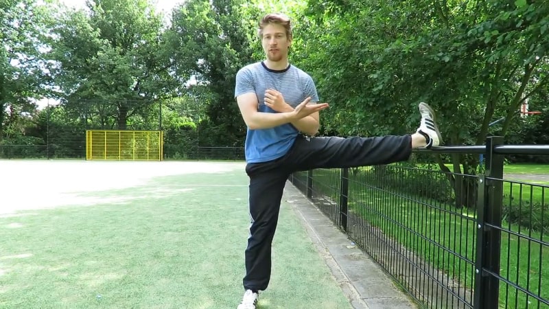 instructor showing stretch for testing splits