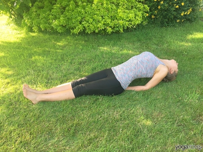 yoga student practicing fish pose for pain between shoulder blades