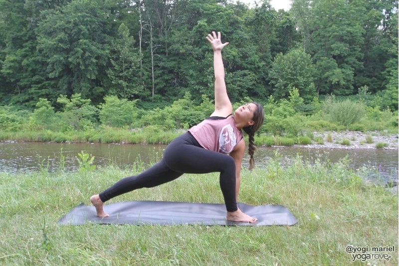 yogi practicing easy twist (low lunge twist) in sweaty yoga practice