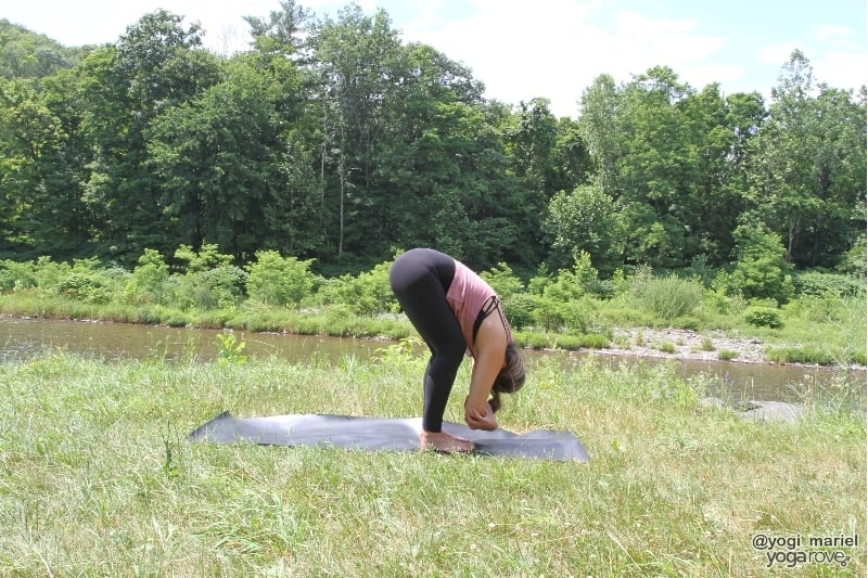 yogi practicing ragdoll in sweaty living room yoga practice