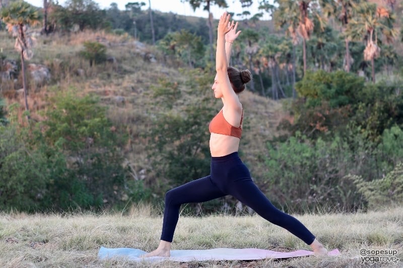 yogi practicing warrior I pose for mobility