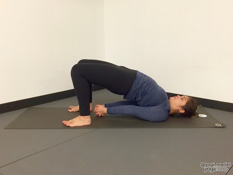 yogi practicing bridge pose for sore muscles.