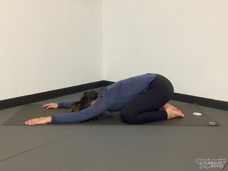 yogi practicing child's pose to relieve sore muscles.