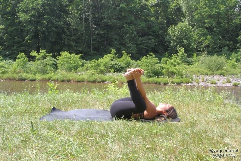yogi practicing happy baby- yin yoga for beginners