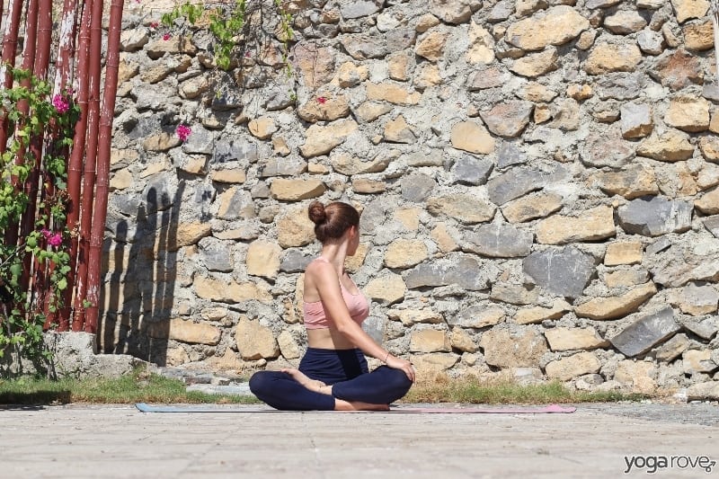 yogi practicing easy seated twist