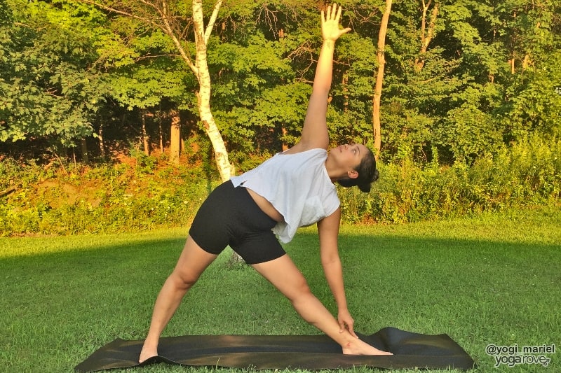 yogi practicing triangle pose