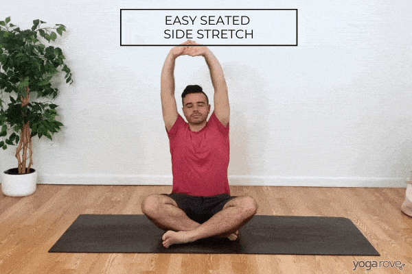 Seated side stretch is a great beginner friendly pose to practice to release tension in the side body, shoulders, and triceps