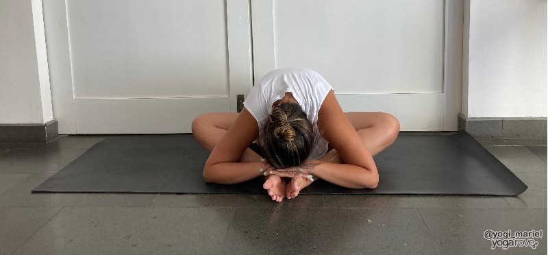 Yogi practicing Bound Angle pose 