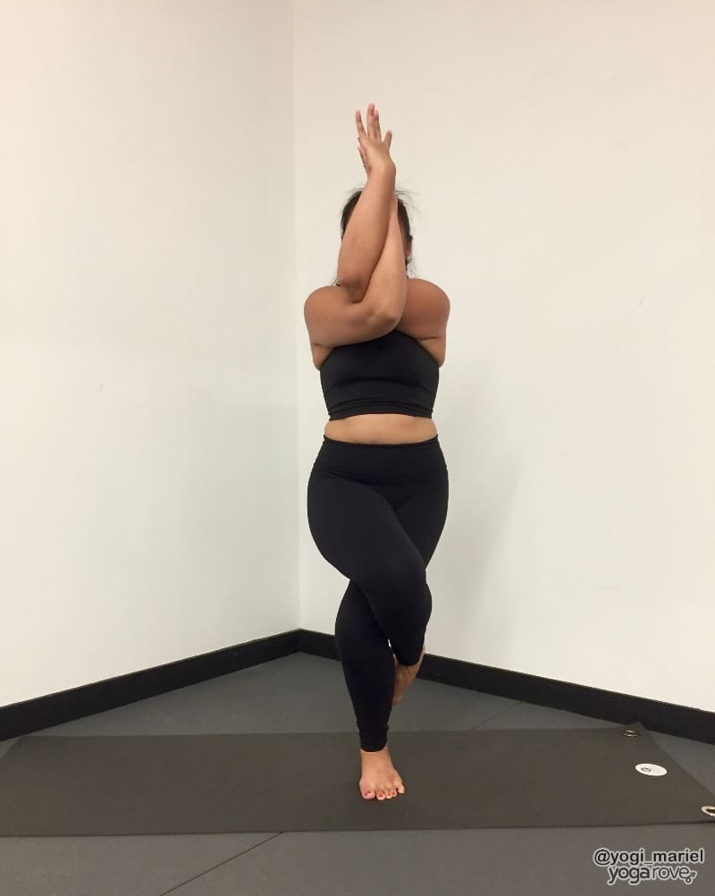 yogi practicing eagle pose- balance and stability routine